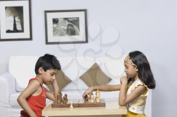 Boy and a girl playing chess