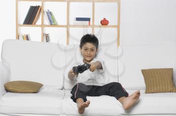 Boy playing handheld video game