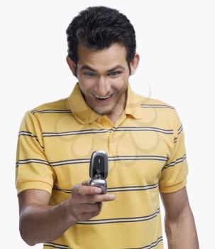 Close-up of a man text messaging on a mobile phone