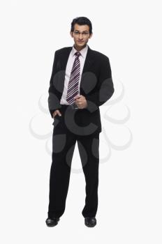 Portrait of a businessman standing with his hand in pocket