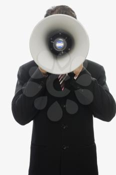 Businessman using a megaphone