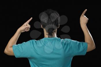 Rear view of a man pointing with his fingers