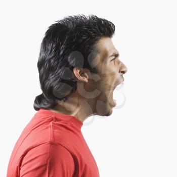 Side profile of a man shouting
