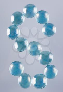 Close-up of marble balls arranged in the shape of letter S