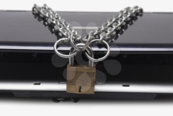 Laptop tied with chain and a padlock