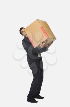 Businessman holding a cardboard box