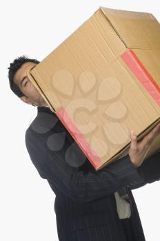 Businessman holding a cardboard box