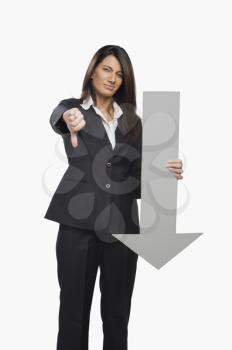 Portrait of a businesswoman gesturing thumbs down sign