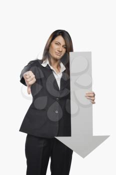 Portrait of a businesswoman gesturing thumbs down sign