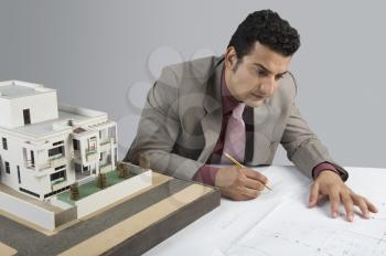 Architect designing a blueprint