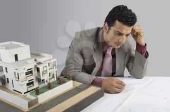 Architect designing a blueprint