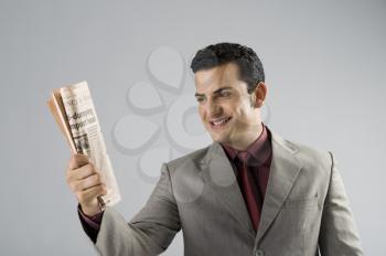 Businessman holding a newspaper