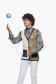 Man tossing a globe