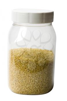 Close-up of mung pulses in a plastic jar