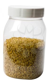 Close-up of pigeon pea pulses in a plastic jar