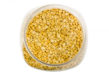 Close-up of pigeon pea pulses in a plastic jar