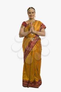 South Indian woman greeting with folded hands