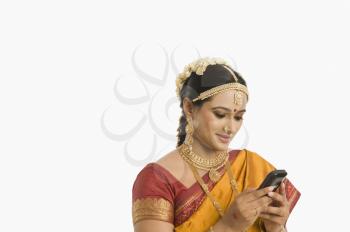 South Indian woman using a mobile phone