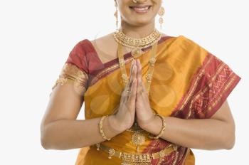 South Indian woman greeting with folded hands