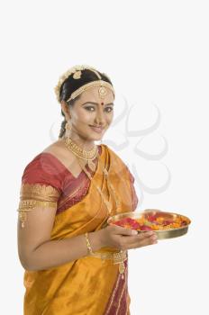 South Indian woman holding pooja thali