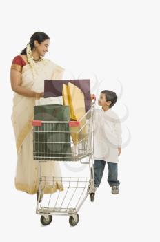 Woman and her son with a shopping cart