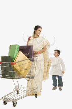 Woman and her son with a shopping cart