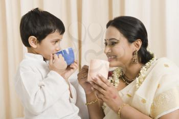 Woman with her son having coffee