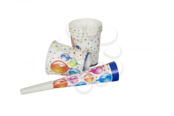 Close-up of disposable cups with a party horn blower