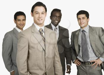Portrait of four businessmen standing together