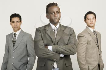 Three businessmen standing together