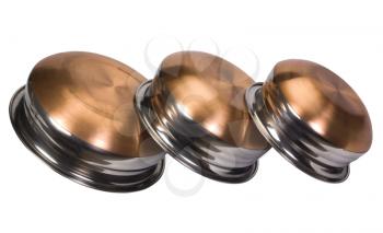 Close-up of three stainless steel cooking pots