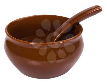 Close-up of a ceramic bowl with a soup spoon