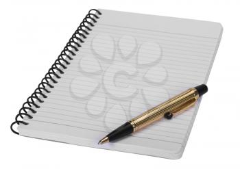 Close-up of a ballpoint pen on a spiral notebook