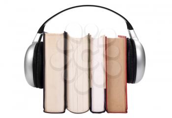 Close-up of books with headphones