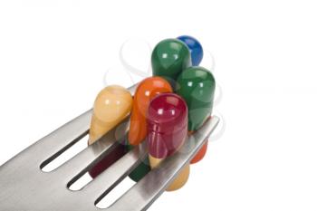 Close-up of capsules on a fork