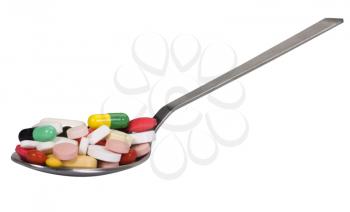 Close-up of a spoon full of pills
