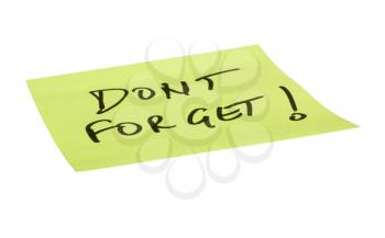 Don't Forget text written on an adhesive note