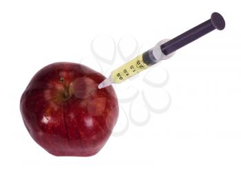 Syringe being injected into an apple