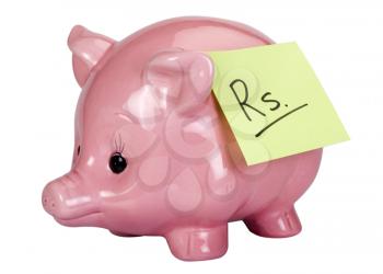 Rupees sign adhesive note stuck on a piggy bank