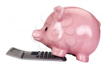 Close-up of a piggy bank on a calculator