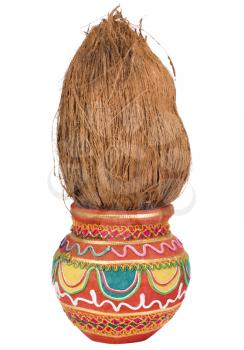 Close-up of a kalash with a coconut