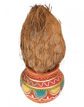 Close-up of a kalash with a coconut