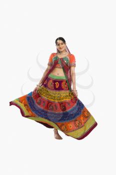 Woman dancing in colorful lehenga choli