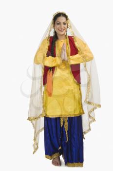 Woman in traditional Punjabi dress greeting