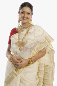 Portrait of a South Indian woman wearing jewelry and sari