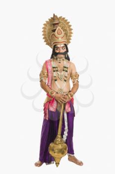 Stage artist dressed-up as Ravana and holding a mace