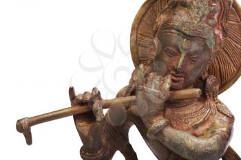 Close-up of a figurine of Lord Krishna