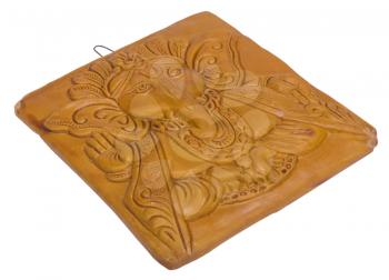 Lord Ganesha engraved on a wooden block