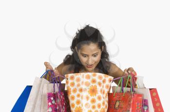 Close-up of a woman looking in shopping bags