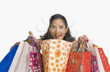 Portrait of a woman carrying shopping bags